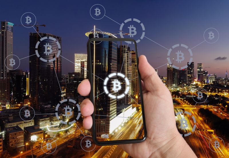 Bitcoin crypto currency blockchain mobile phone modern city