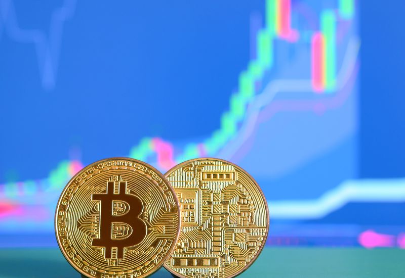 Golden Bitcoins with Crypto Graphic Behind