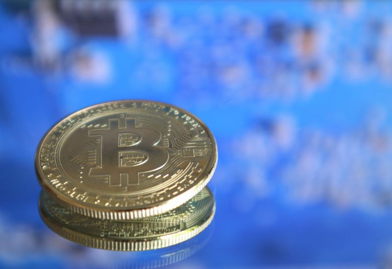Bitcoins above blue background