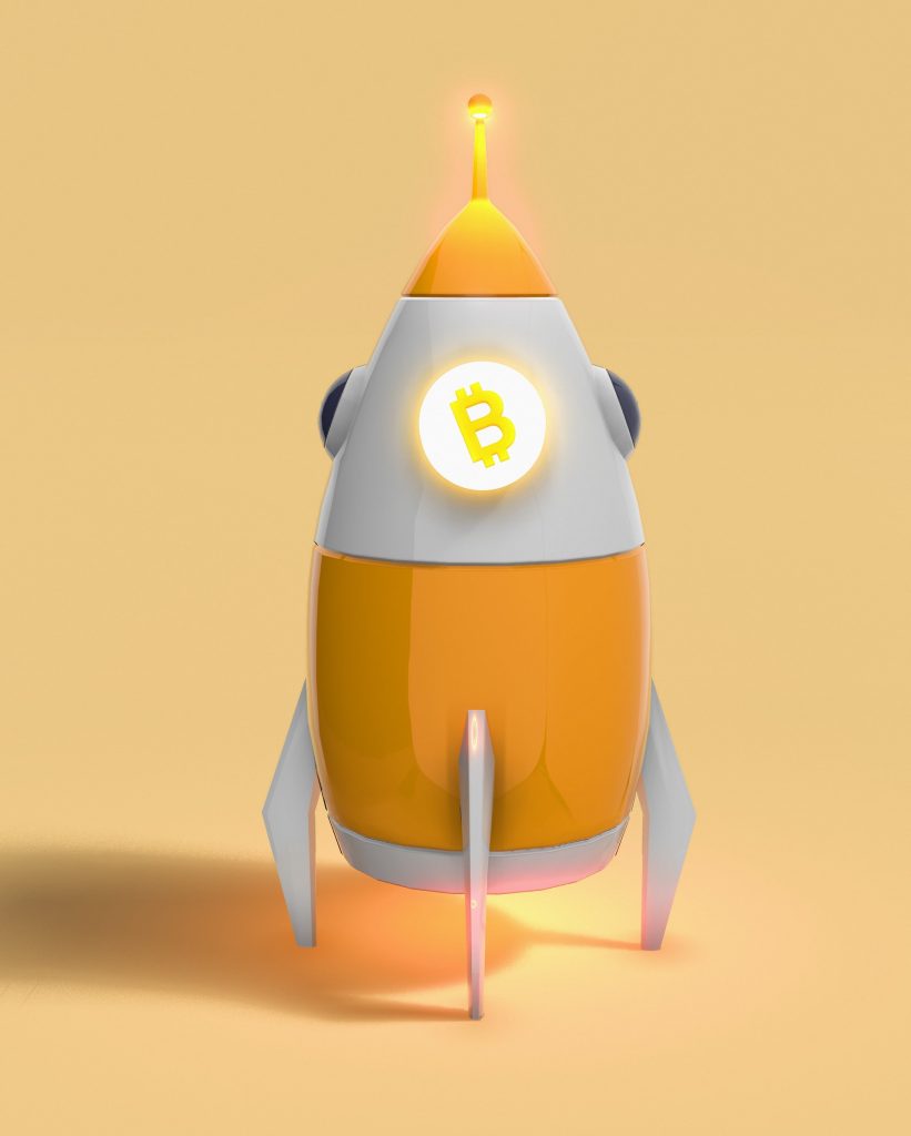 Image of a rocket with the Bitcoin logo on it.
