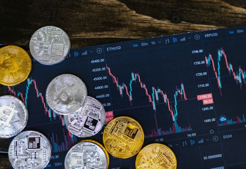 Crypto Coins Above Crypto Trading Graphic