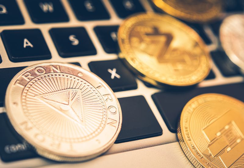 Crypto Coins above a Computer