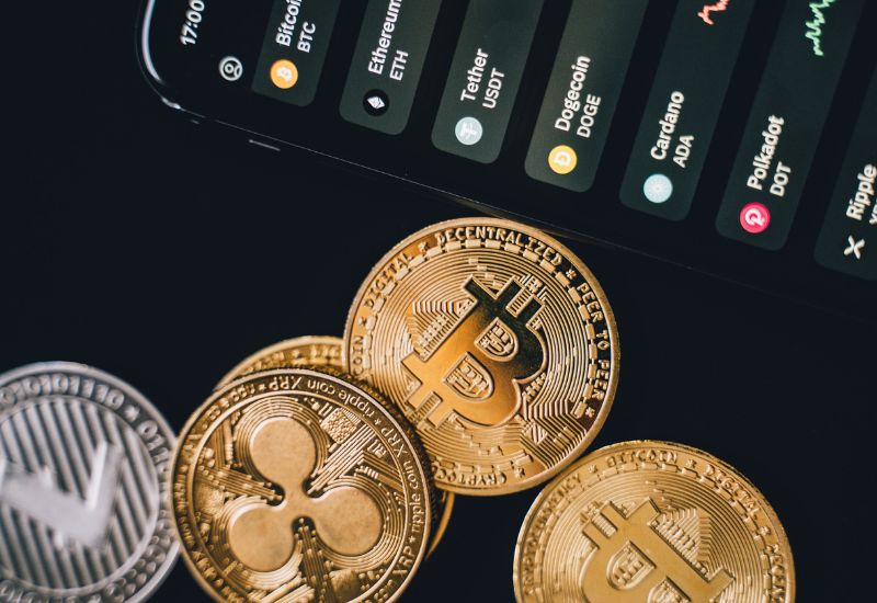 Crypto Coins and Phone Display with Crypto Trading Graphic