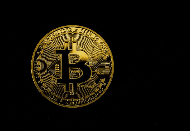 Golden Bitcoin black background