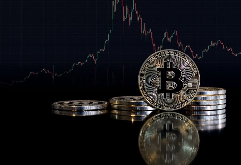 Bitcoins and Crypto Trading Graphic Behind