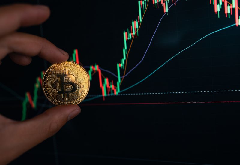 Bitcoin on Hand and Crypto Investing Graphic