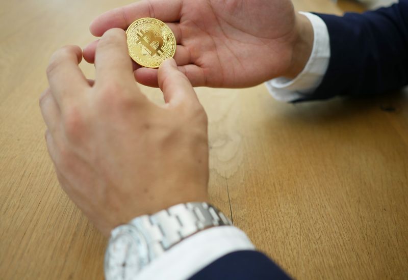 Hands holding bitcoin