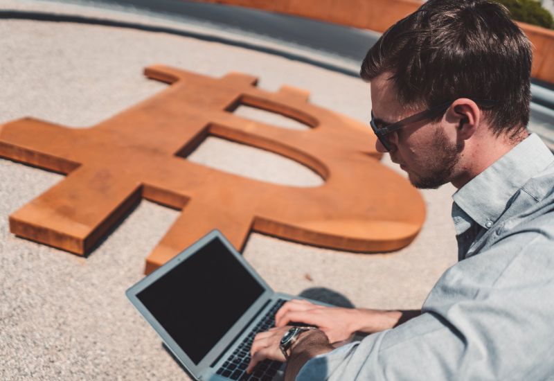 Investor and Bitcoin Symbol